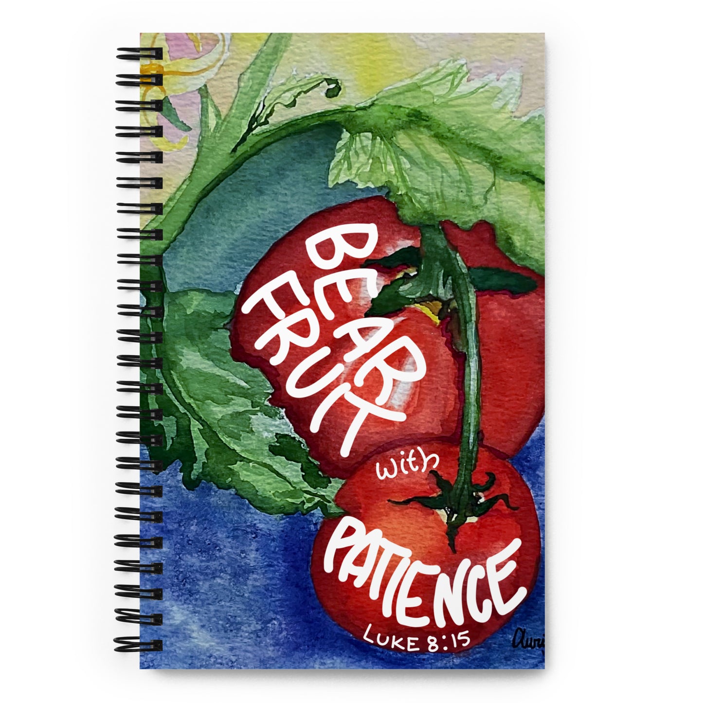 A spiral-bound notebook featuring a watercolor-style illustration of red tomatoes on the cover with the words 'BEAR WITH PATIENCE LUKE 8:15' in white script.