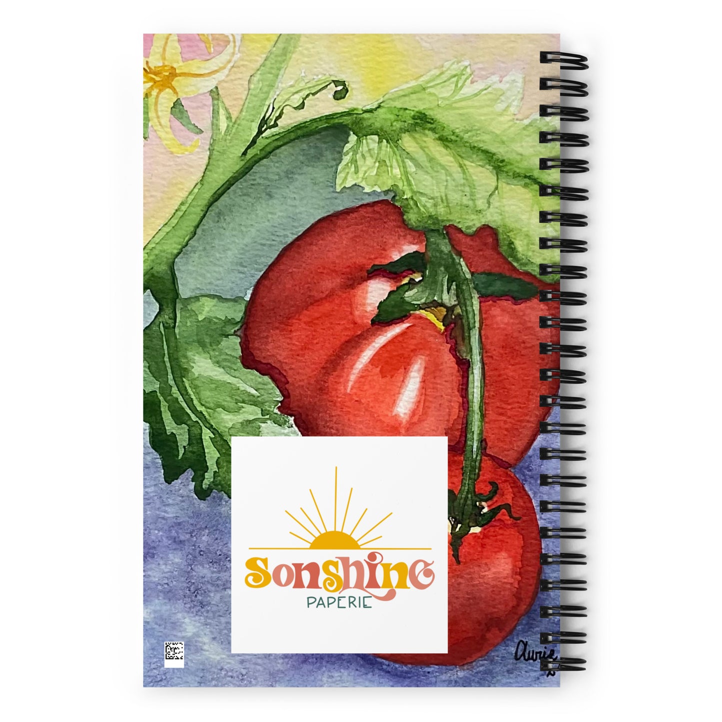 A spiral-bound notebook featuring a watercolor illustration of red tomatoes on the cover, with a white label reading 'Sunshine Paperie' in the center and a black spiral binding along the right edge.